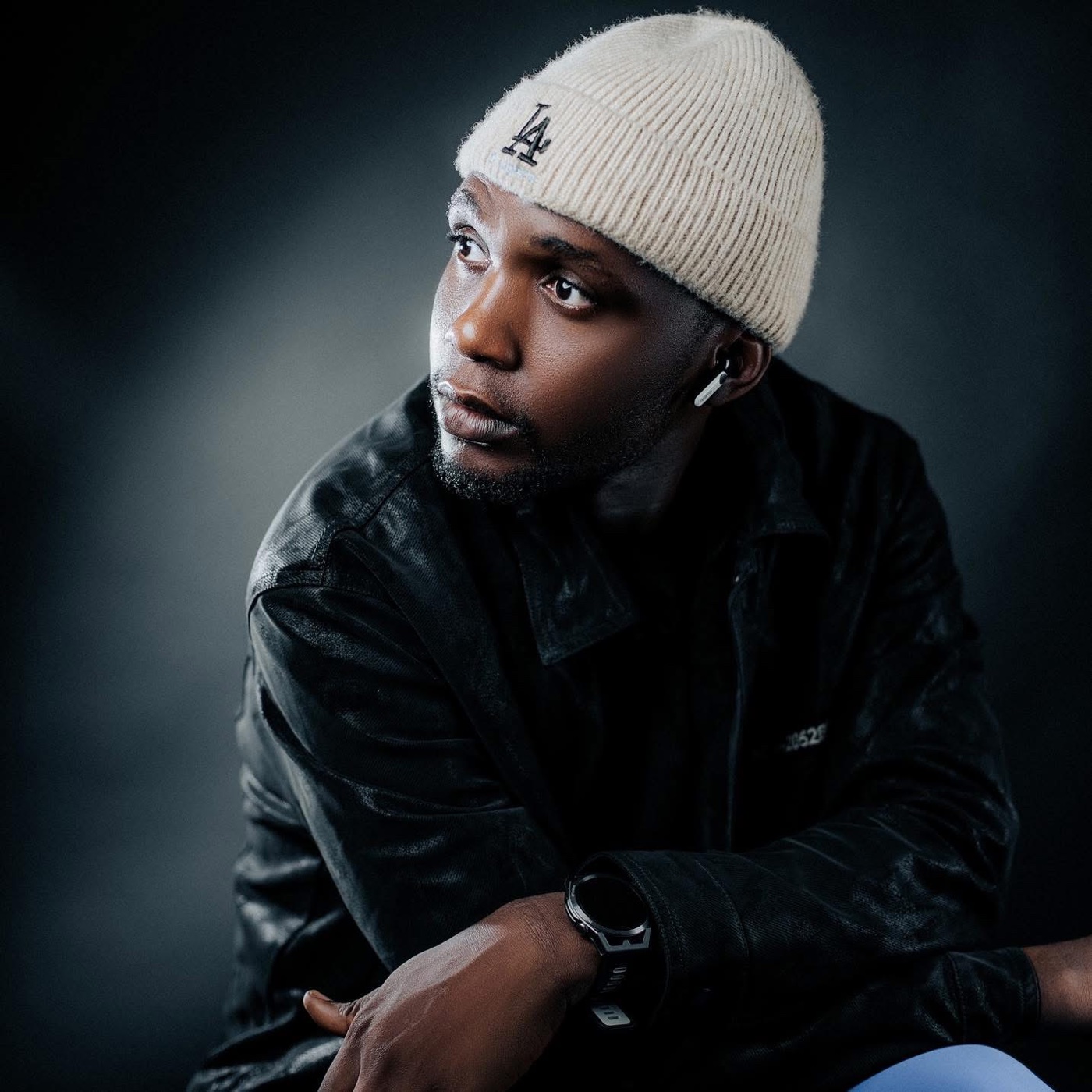 Beanie Soulja in a dark studio portrait